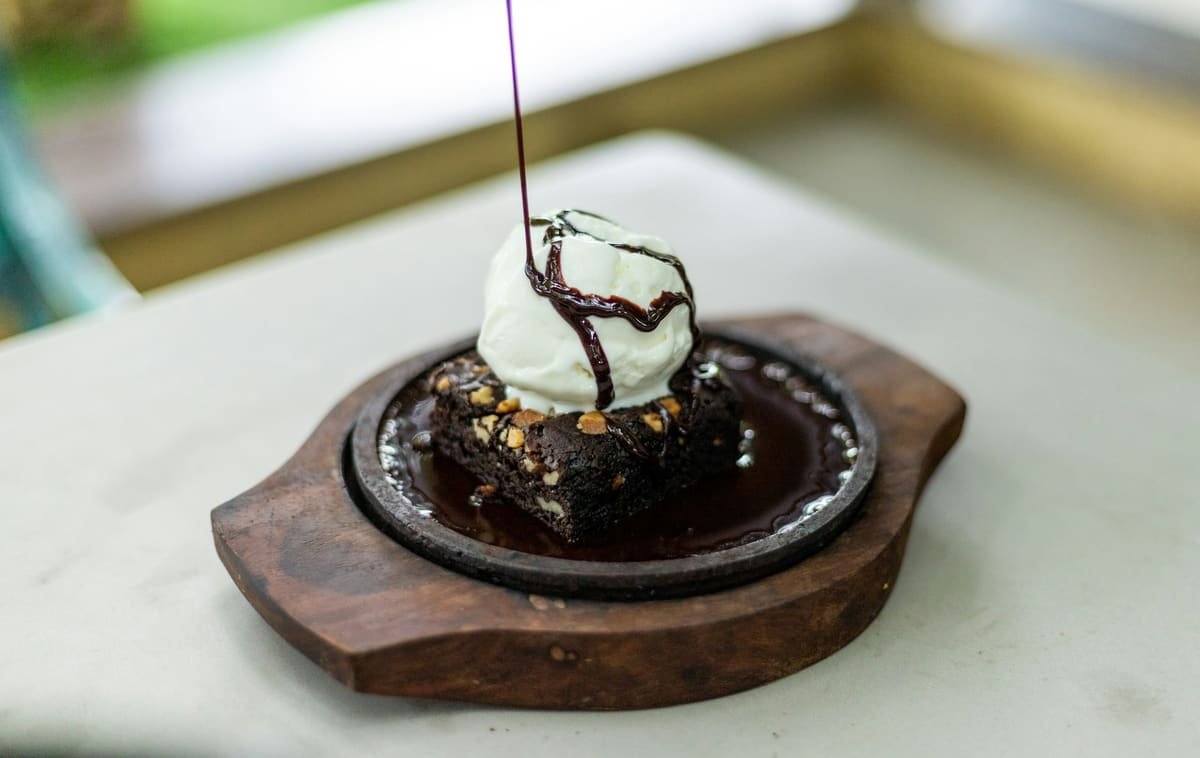 Warm chocolate brownie with vanilla ice cream and chocolate sauce