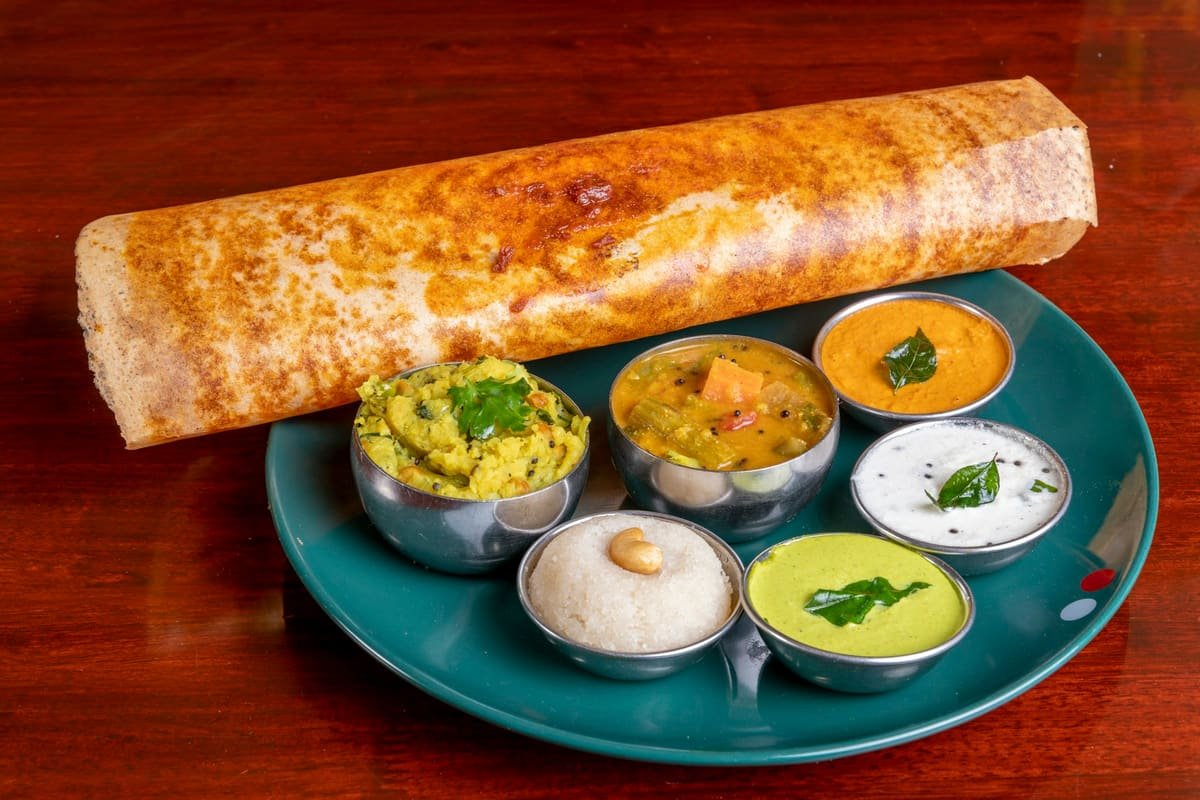 Crisp masala dosa with potato masala, sambar and three chutneys