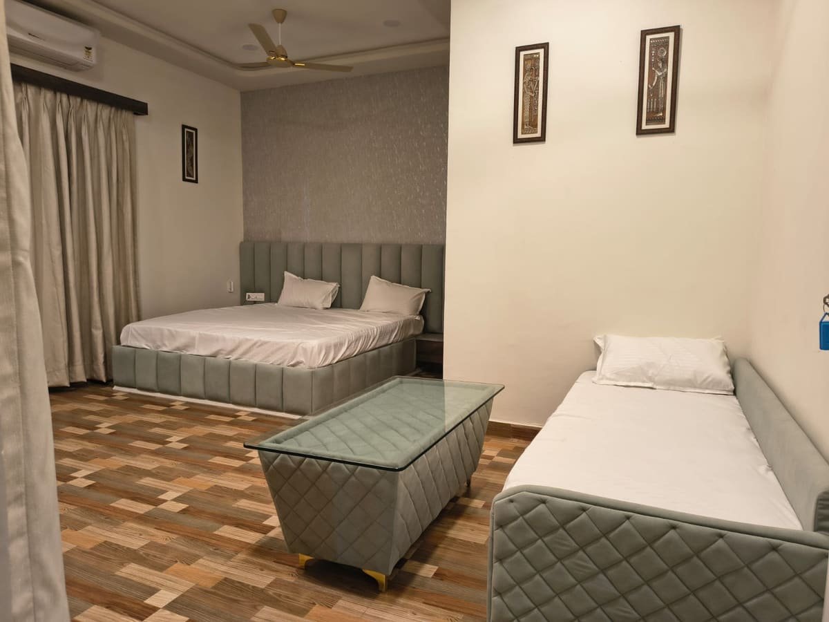 Guest room with a double bed and an extra single bed